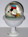 Snoopy & Woodstock playing hockey on bird bath Snowglobe