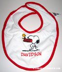 Snoopy with dogdish in mouth Bib