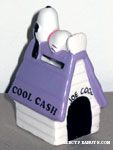 Joe Cool laying on Purple Doghouse 'Cool Cash' Bank