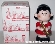 Lucy holding Trumpet Bank