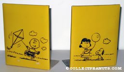 Charlie Brown flying kite & Lucy holding balloon with Snoopy Bookends
