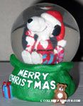 Santa Snoopy in gift bag Snowglobe