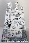 Snoopy on doghouse covered in comics Figurine