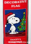 Snoopy standing next to Christmas Tree Flag