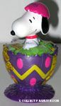 Snoopy cracking out of pink egg with yellow top Candy Container
