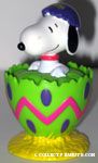 Snoopy cracking out of green egg with purple top Candy Container
