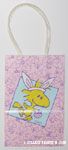 Woodstock wearing bunny ears with Easter Basket