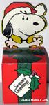 Snoopy coming out of 'Seasons Greetings' gift box