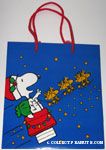 Santa Snoopy on doghouse driving Woodstock reindeer Gift Bag