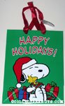 Snoopy holding gift boxes and Woodstock Gift Bag