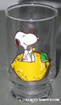 Snoopy sitting on lemon juice glass