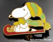 Snoopy and Woodstock sledding Pin