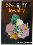 Snoopy in hockey gear on bench Pin