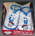 Snoopy handing balloons to Woodstock Baby Shoes