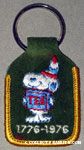 Snoopy as Indian holding box of tea Bicentennial Keychain