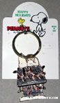 Snoopy laying on decorated doghouse Keychain