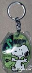 Snoopy dancing on clear green Keychain