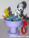 Snoopy & Woodstock playing hockey on birdbath Keychain