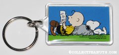 Charlie Brown and Snoopy leaning on rock Keychain