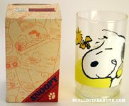 Snoopy licking his lips with Woodstock Glass