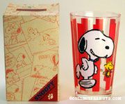 Snoopy and Woodstock dancing on red stripe background Glass