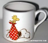 Woodstock carrying Snoopy in blanket as a stork Mug