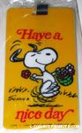 Snoopy dancing with basket of flowers 'Have a nice day' Luggage Tag