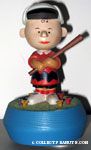 Charlie Brown standing in mushroom patch with baseball bat Musicbox