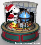 Santa Snoopy & Woodstock with toys & globe in front of fireplace Music Box