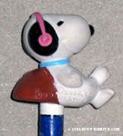 Snoopy leaning on rock wearing headphones Pencil Topper & Eraser