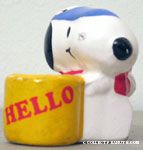 Snoopy sitting using Telephone next to 'Hello' Cup Single Pencil Holder