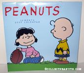 Lucy holding football for Charlie Brown 2009 Calendar