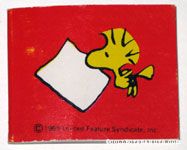 Woodstock flying with paper in his mouth Pad