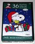 Snoopy holding gift boxes and Woodstock Box of Assorted Cards