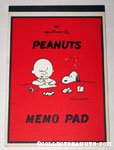 Charlie Brown writing Letter with Snoopy looking on Memo Pad