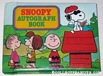 Snoopy signing autographs on doghouse Autograph Book
