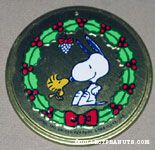 Woodstock kissing Snoopy's nose under mistletoe Round Metal Ornament