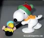 Snoopy and Woodstock playing hockey Ornament