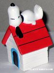 Snoopy lying on Doghouse