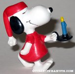 Snoopy in nightgown holding candle PVC Figurine