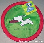 Snoopy running with toy Flying Disc