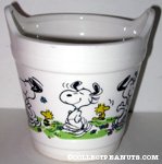 Santa Snoopy leaning on chimney with wreath Planter