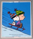 Linus & Snoopy sledding Framed Print