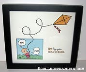 Charlie Brown with kite 'Try. Try again...' Framed Print
