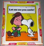 Snoopy kissing Peppermint Patty 'Let me see you smile' Puzzle