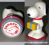 Snoopy holding gift package with Snoopy wearing hat Rubber Stamp Figure