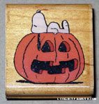 Snoopy lying on pumpkin Rubber Stamp