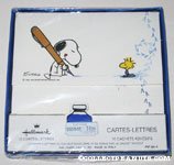 Snoopy with over-sized pen and Woodstock Stationery