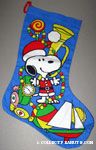 Santa Snoopy standing with toys Stocking