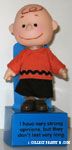 Charlie Brown on pedastal box 'I have very strong opinions, but they don't last very long' Doll